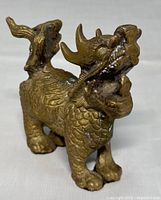 Front angled view showing head, horns, body texture, legs