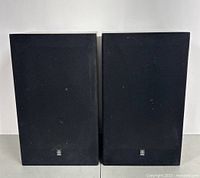 Front view of both Yamaha NS-144 speakers with grilles attached
