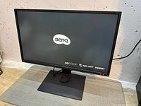 Front view powered on showing BenQ logo