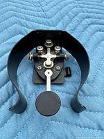 Top view of Winslow Tele-Tronics J-37 key mounted on black curved J-45 leg base