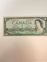 Front of 1954 Devil’s Face $1 bill showing serial number and portrait