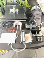 Heat press with multiple attachments and manual
