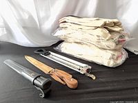 Overall lot showing two sheath cutters, thermometer, stacked gloves