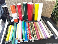 Group of vinyl rolls showing various colors and patterns