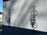 Both sconces mounted on wall