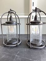 Front view of both lanterns showing overall design and condition