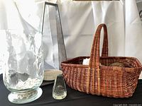 Overall lot showing vase, steel candle holder, basket, glass paperweight