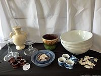 Group shot showing all items including jardiniere, bowls, napkin rings, vase, candle holders, blue bowl, shells