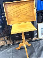 pedestal plant stand with tray resting on top