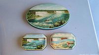 Top view of three tins showing Niagara Falls artwork