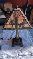 Full view of lamp showing shade artwork and base