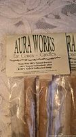 Close-up of package header showing Aura Works branding and materials list