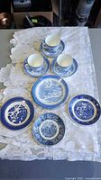 Full lot showing teacups on saucers plus assorted plates