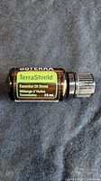Front view of the doTERRA TerraShield 15 mL essential oil bottle