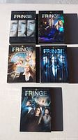 Five Fringe season DVD box sets front view