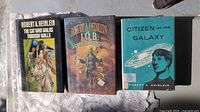 Front covers of all three Heinlein hardcovers