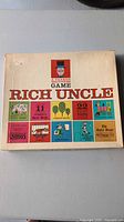 Lid of Parker Brothers Rich Uncle game box