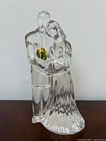 Front view of crystal couple figurine with sticker visible