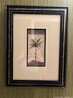 Front view of framed palm tree art with mat and frame details