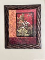 Front view of framed tropical floral artwork showing entire piece
