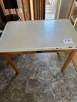 Full top view of enamel surface and maple legs