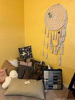 Group view of assorted cushions and dream catcher