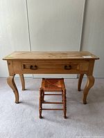 Front view of pine console table with maple stool beneath