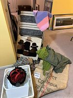 overall lot showing rugs, throws, drying rack, jute sack, plastic tub