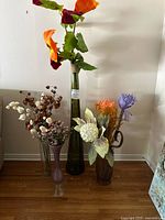 Group shot of four vases with floral arrangements