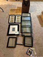 Overview of assorted frames on floor