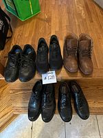 Group shot of all five pairs on steps