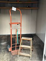 Hand truck and wood ladder full view