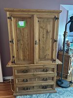 Front view of cabinet on stand, doors closed