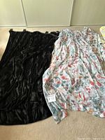 Black velvet and floral sheer panels laid out side by side