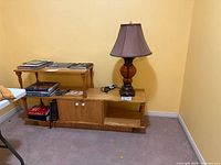 Stand and lamp front view against wall