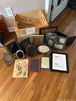 Group shot of all 14 tabletop frames on floor