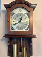 front view of clock showing dial and case