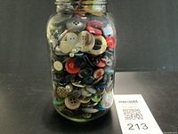 Front view of jar packed with mixed buttons