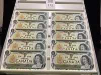 All ten sequential Canadian $1 notes displayed in tray