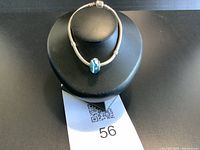 Bracelet displayed on black stand showing overall appearance