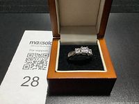 Ring in open display box showing overall appearance