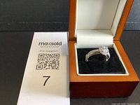 Ring in open presentation box, full view