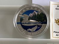 Colourized reverse of 2016 Canadian $20 Geometry in Art coin in capsule