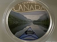 Colour reverse of coin showing kayak on river, CANADA 1867-2017 legend