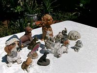 All figurines arranged on table outdoors