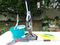 Group shot showing Bissell CrossWave, Spin & Go bucket, O-Cedar spray mop, Swiffer and Quickie heads