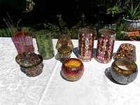 All nine mosaic glass items on table