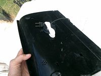 Underside of black FoodSaver sealer showing cord