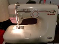 Full view of Simplicity Fashion Sense sewing machine showing body and spool area