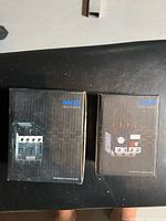 Two boxed MCG control units side by side